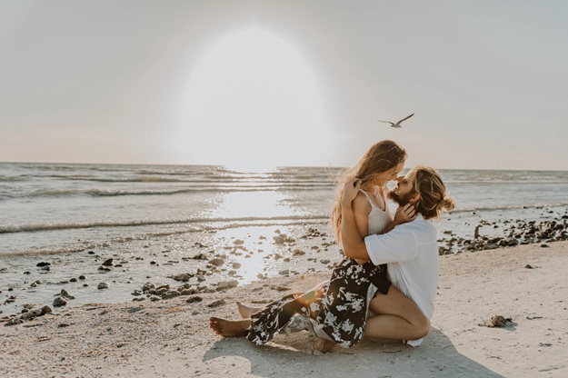 Romantic honeymoon portrait on the shore