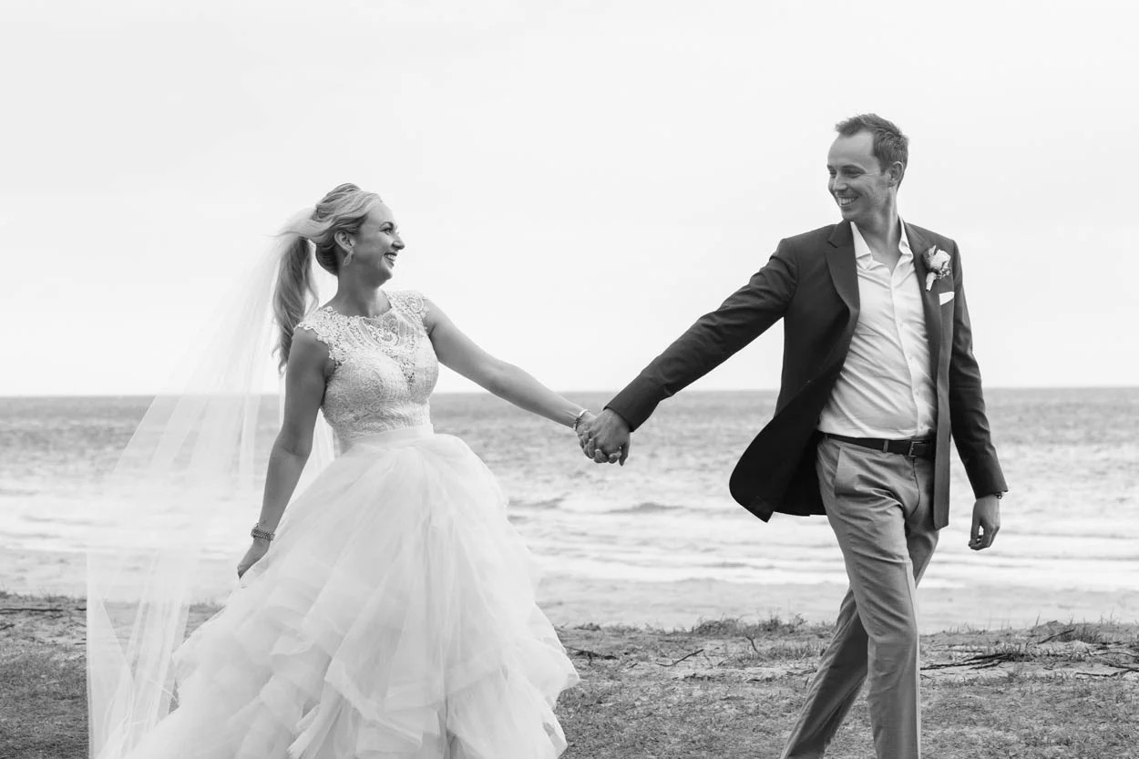 Vow renewal at Turtle Beach with palm fronds and tiki accents